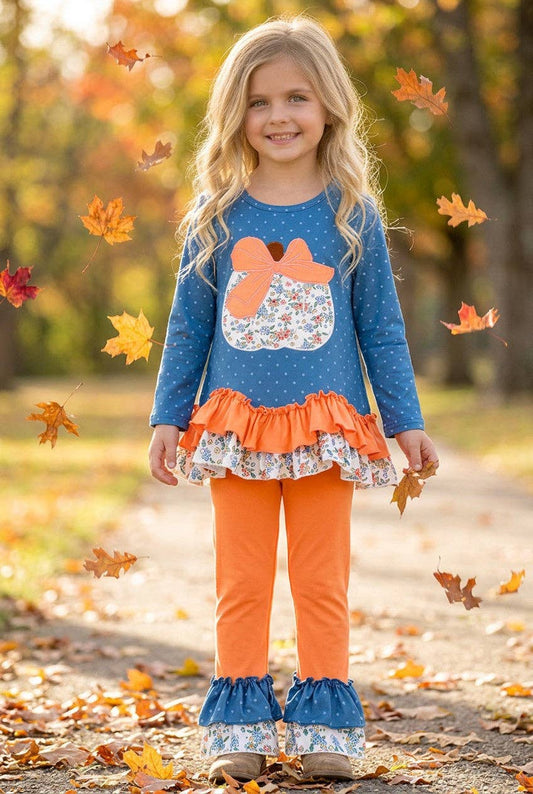 Blue top w/white polka dot & ruffle hem and orange pants. OFG61765 JEAN